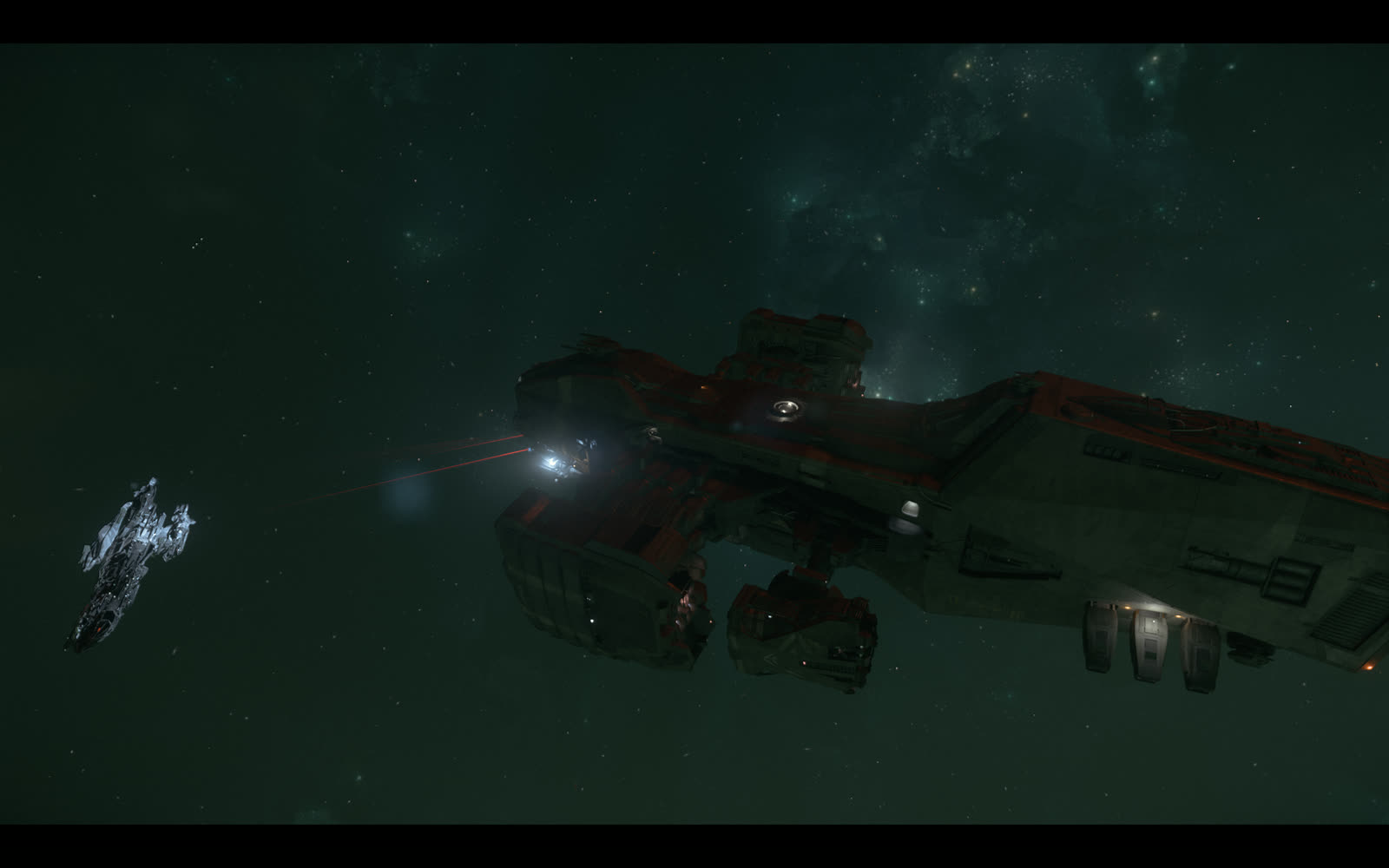 星雲を背景に航行する大型艦と随伴する小型艦